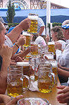 Oktoberfests with traditional beer steins